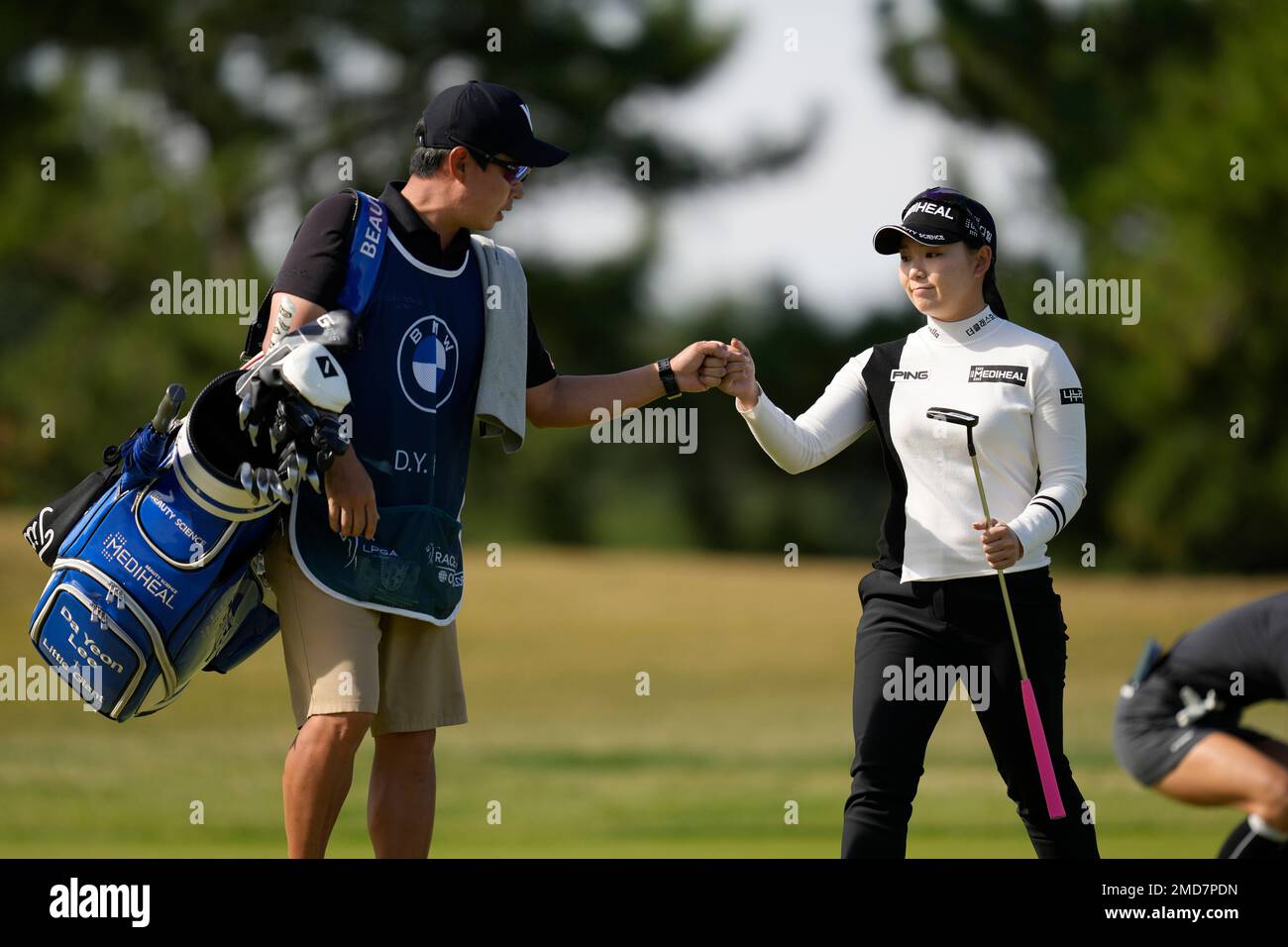 Da Yeon Lee of South Korea reacts with her caddie after making a putt ...