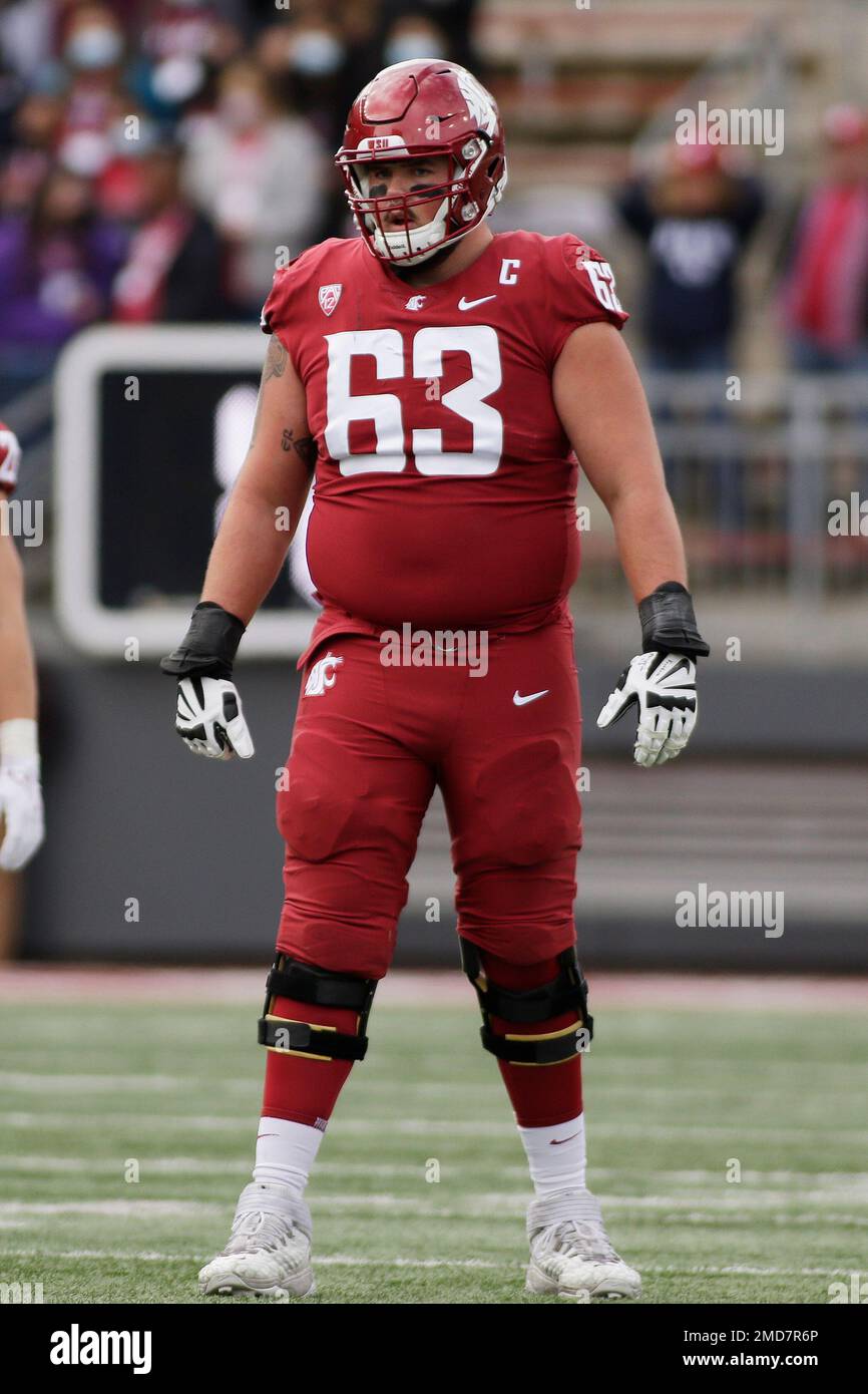 Washington State offensive lineman Liam Ryan stands on the field during