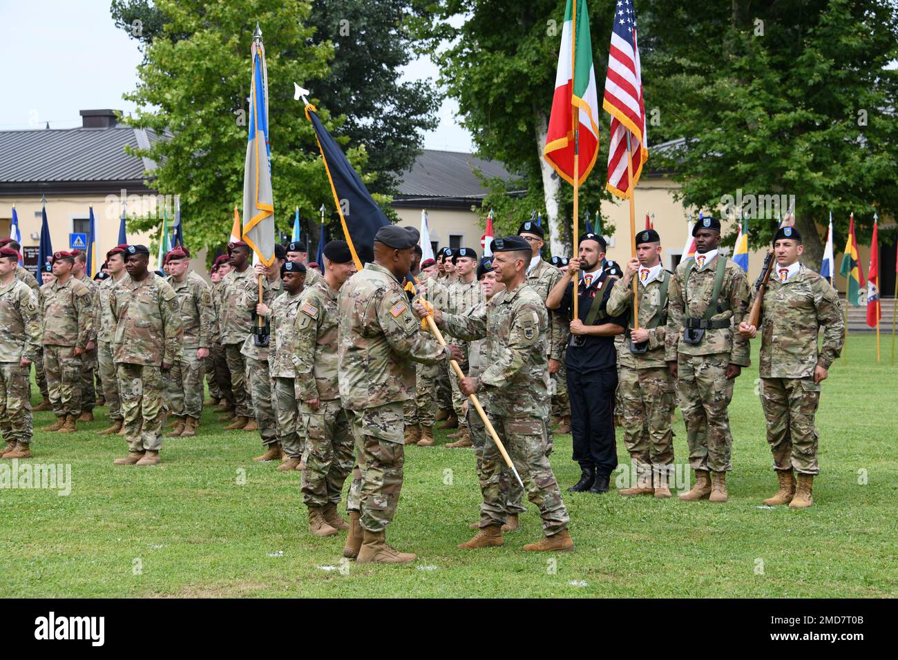 Maj. Gen. Andrew M. Rohling, U.S. Army Southern European Task Force, Africa outgoing commander, passes the U.S. Army Southern European Task Force, Africa guidon to Gen. Darryl Williams, commander of U.S. Army Europe & Africa (USAREUR-AF) during the SETAF-AF Change of Command Ceremony at Caserma Ederle in Vicenza, Italy, July 14, 2022. Stock Photo