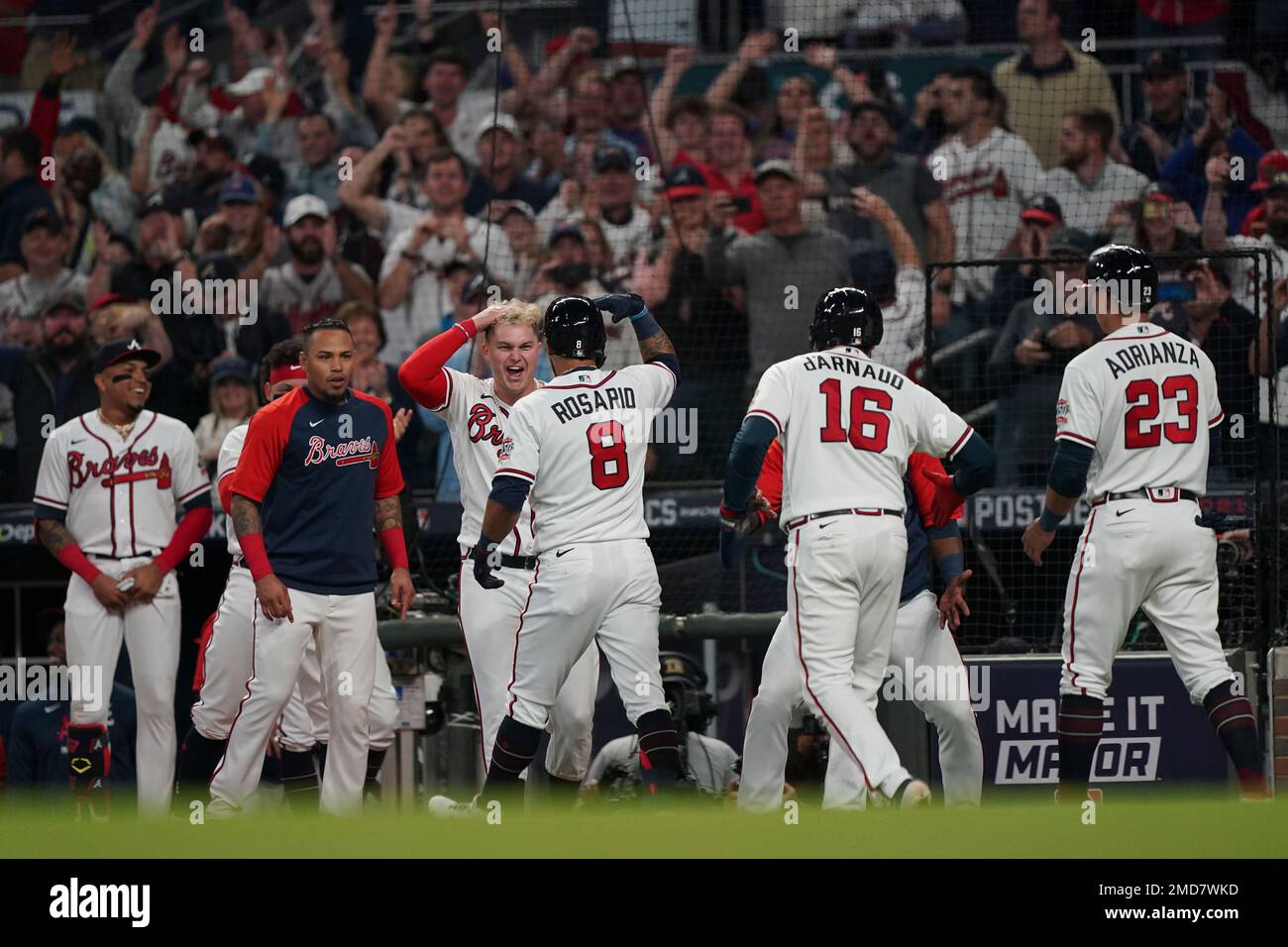 Eddie Rosario of the Atlanta Braves celebrates after hitting a