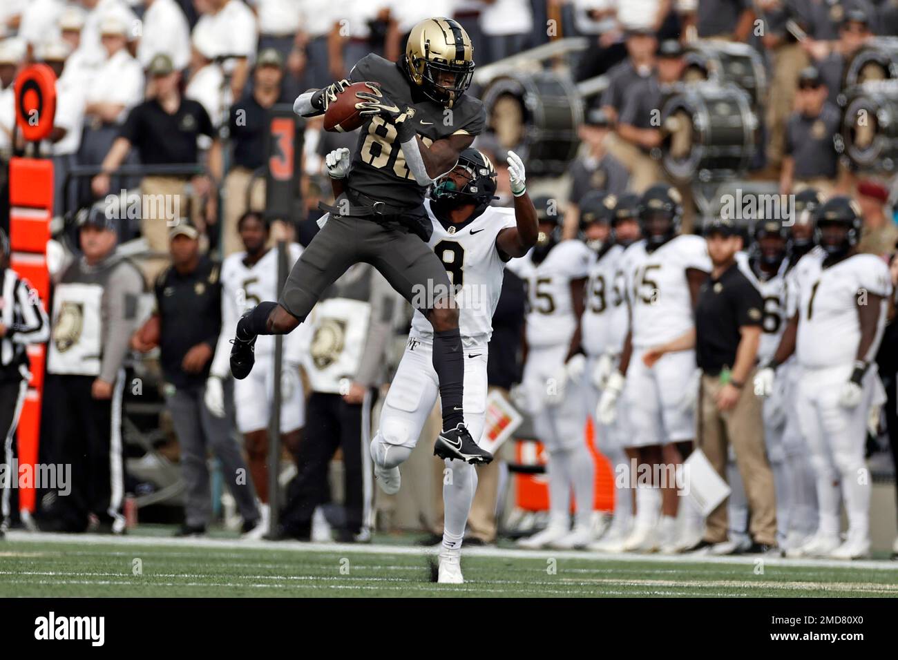 Army wide receiver Isaiah Alston (86) makes a catch in front of