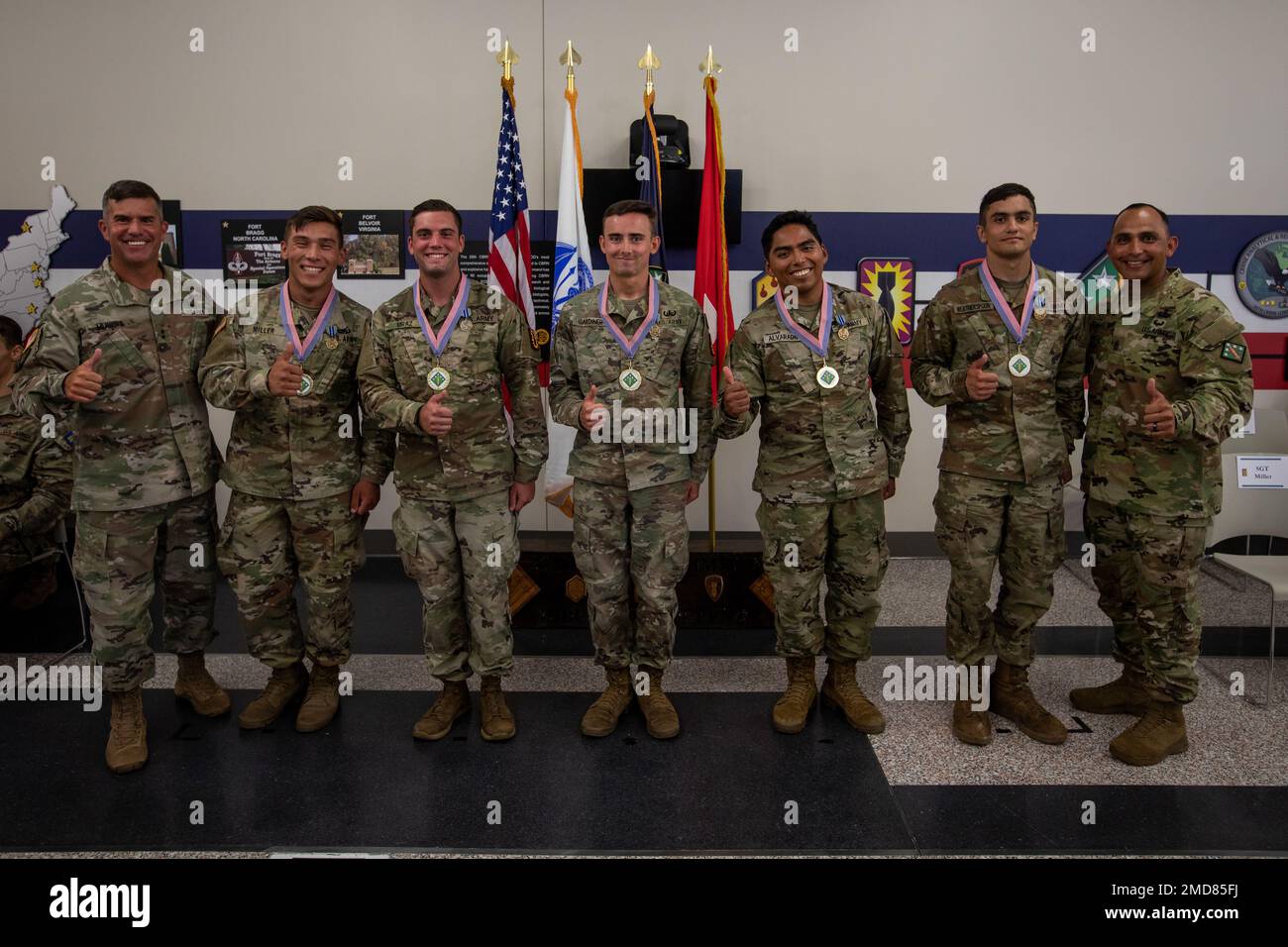 The winners from the 20th Chemical, Biological, Radiological, Nuclear, and Explosives (CBRNE) Best Warrior Competition, Best NCO is Sgt. Micah Miller, an explosive ordnance technician with 52nd Ordnance Group, Best Soldier is Spc. Logan Gardiner, an EOD tech with 52nd EOD, and Best Officer is Cpt. John Lintner with 48th Chemical Brigade, pose for a photo during the awards ceremony at Aberdeen Proving Ground, Maryland, July 14, 2022. The 20th CBRNE Command’s Best Squad Competition and Best Warrior Competition is a single event used to select the best Noncommissioned Officer of the Year and Sold Stock Photo