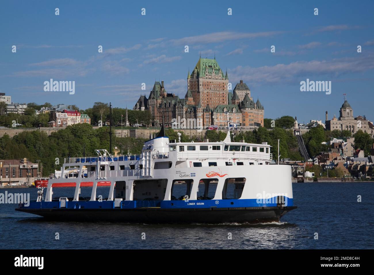 Lomer Gouin ferry boat and Old Quebec City skyline with Chateau Frontenac in spring, Quebec, Canada. Stock Photo