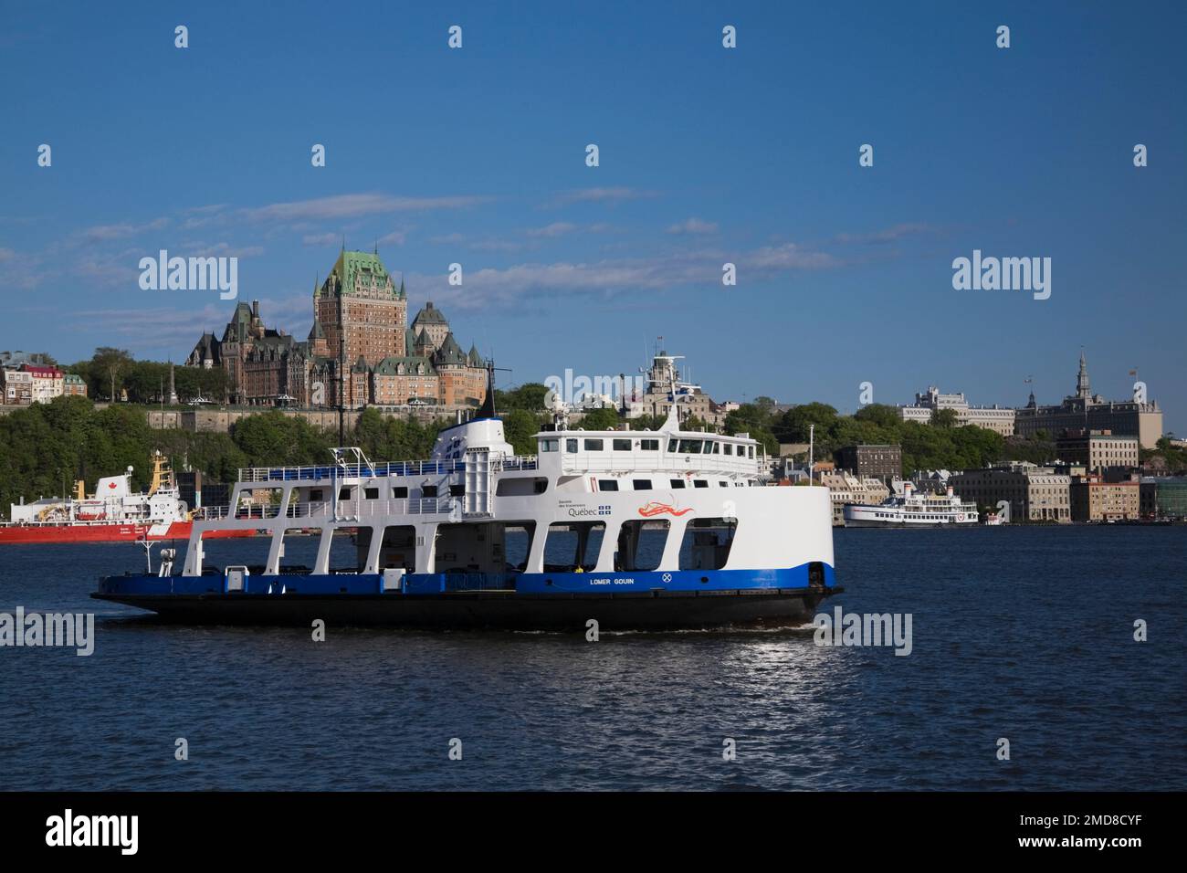 Lomer Gouin ferry boat and Old Quebec City skyline with Chateau Frontenac in spring, Quebec, Canada. Stock Photo