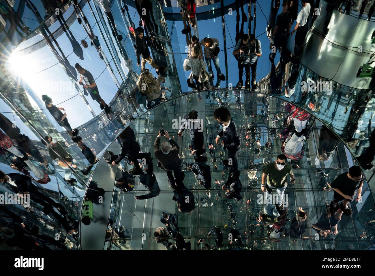Visitors pass through a mirrored room during the grand opening of ...