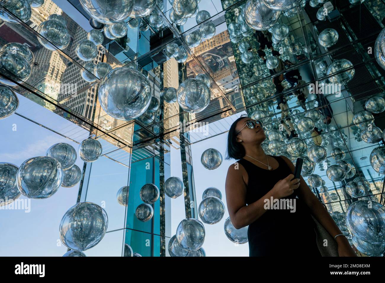 An invitee browses a roomful of heliumfilled balloons at the grand