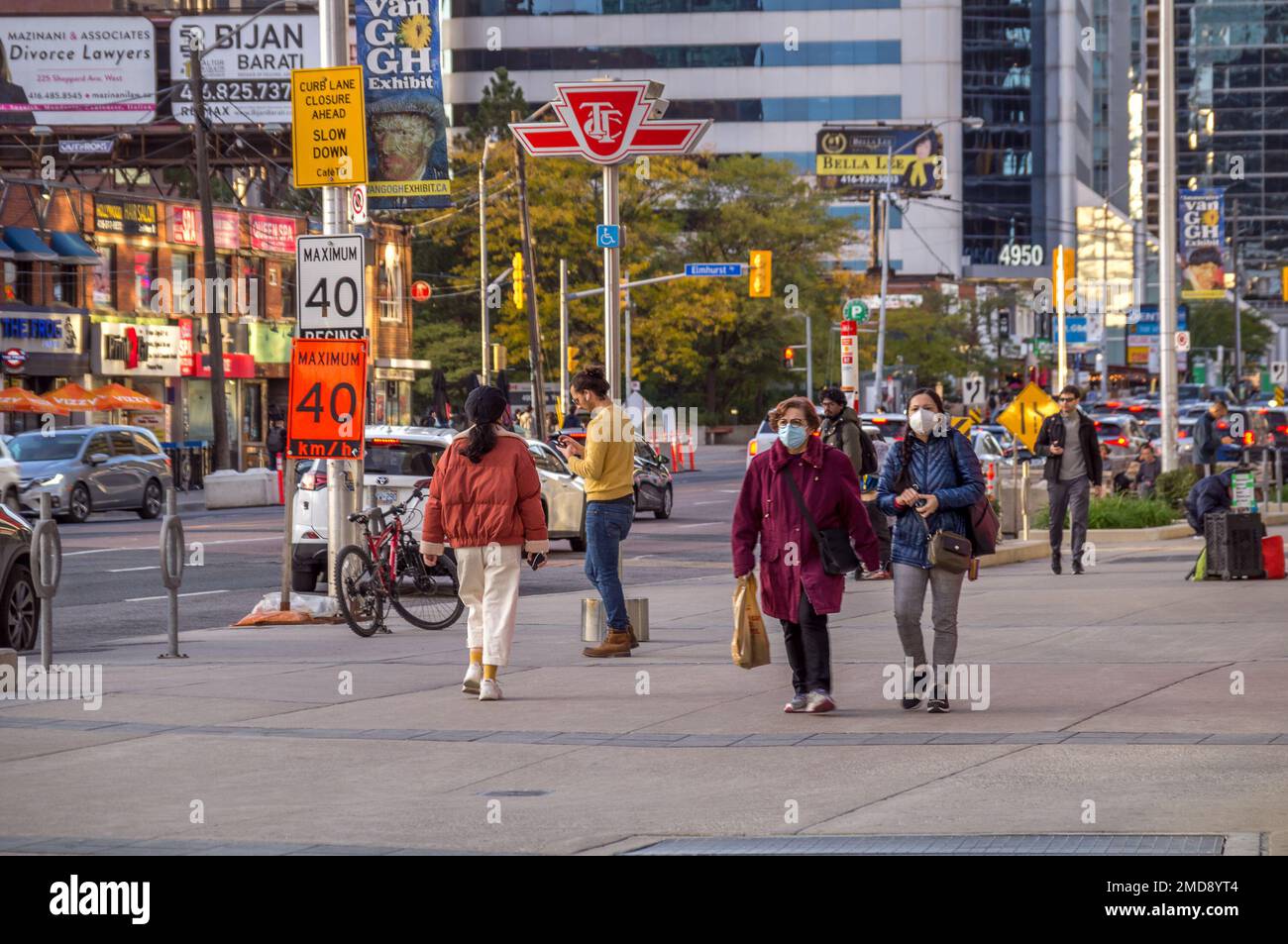 Toronto, Ontario, Canada - 10 03 2022: Summer view along Younge Street in North York neighborhood of Toronto city with Torontonians walking in front Stock Photo