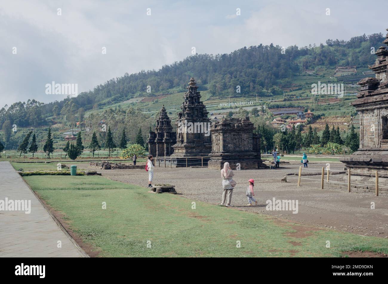 Banjarnegara, Indonesia - January 20, 2023: Tourists visit Candi Arjuna Hindu temple in Dieng Plateau. Stock Photo