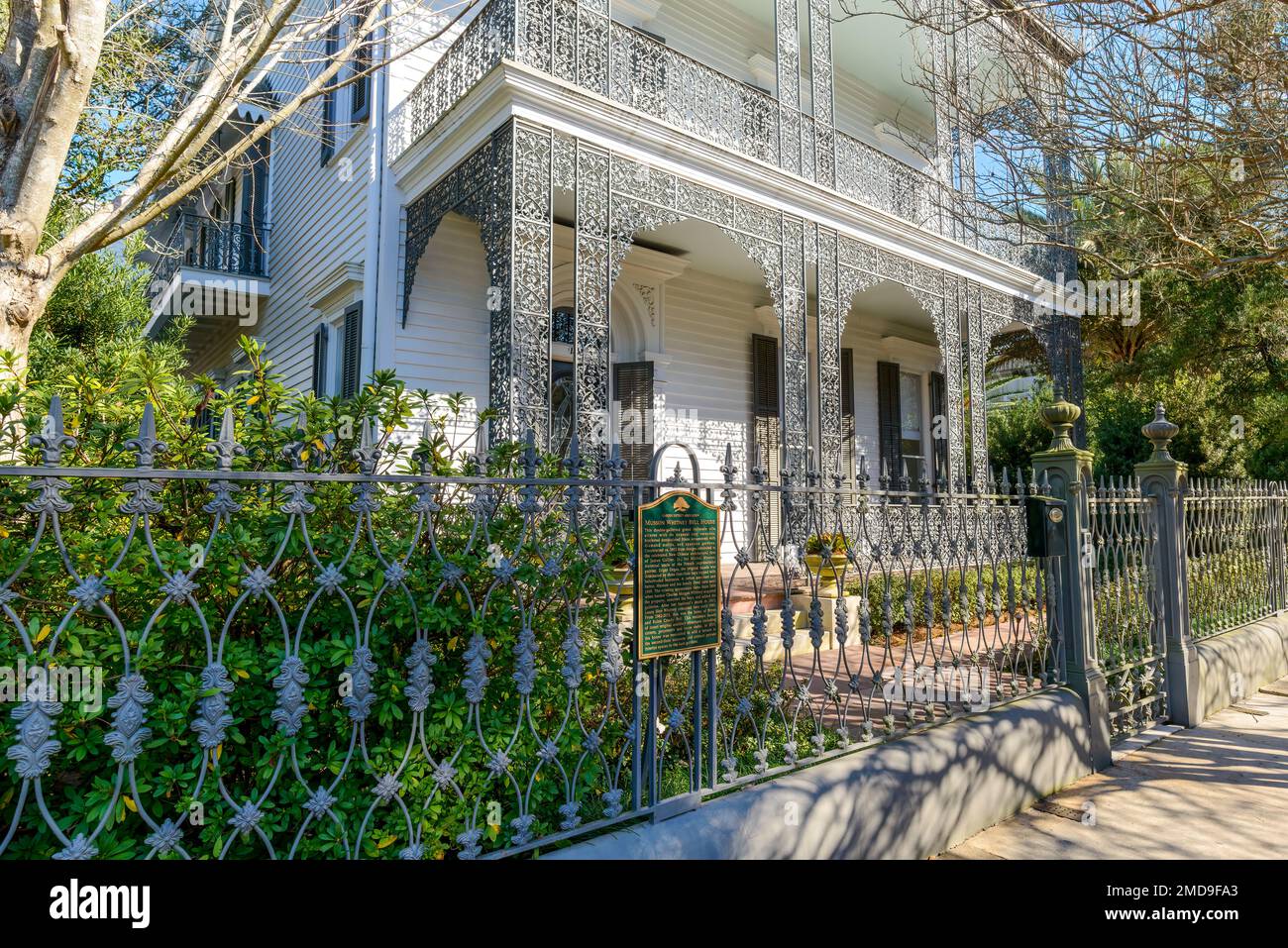 NEW ORLEANS, LA, USA - JANUARY 15, 2023: Front of Historic Musson Whitney Bell House Displaying Elaborate Ornamental Iron Fence and an Historic Marker Stock Photo