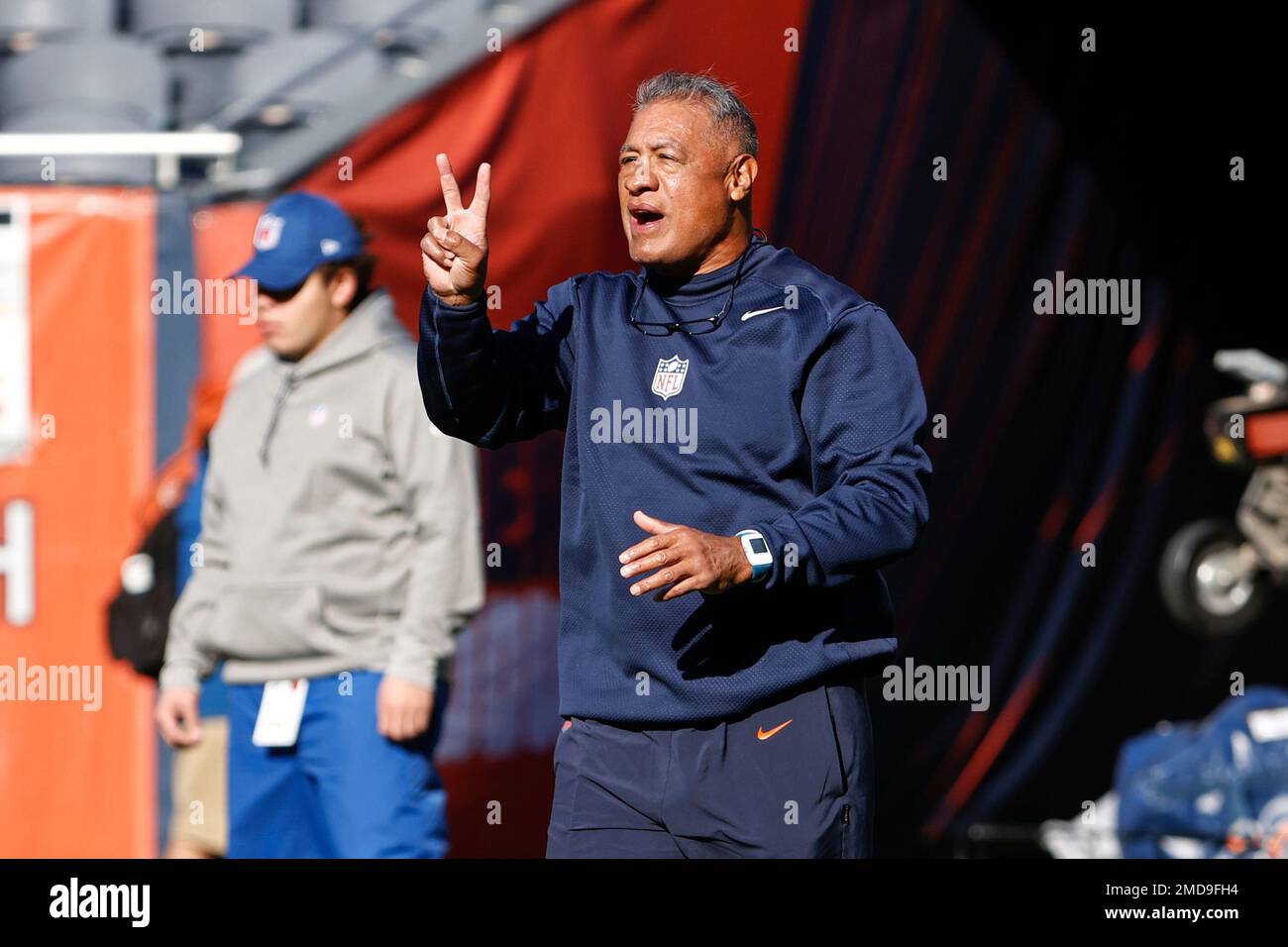 Chicago Bears offensive line coach Juan Castillo signals as he walks on the  field prior to an NFL football game against the Green Bay Packers, Sunday,  Oct. 17, 2021, in Chicago. (AP