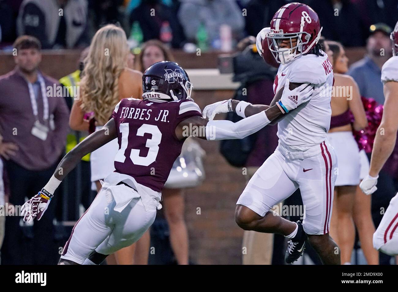 Alabama wide receiver John Metchie III (8) is pursued by Mississippi