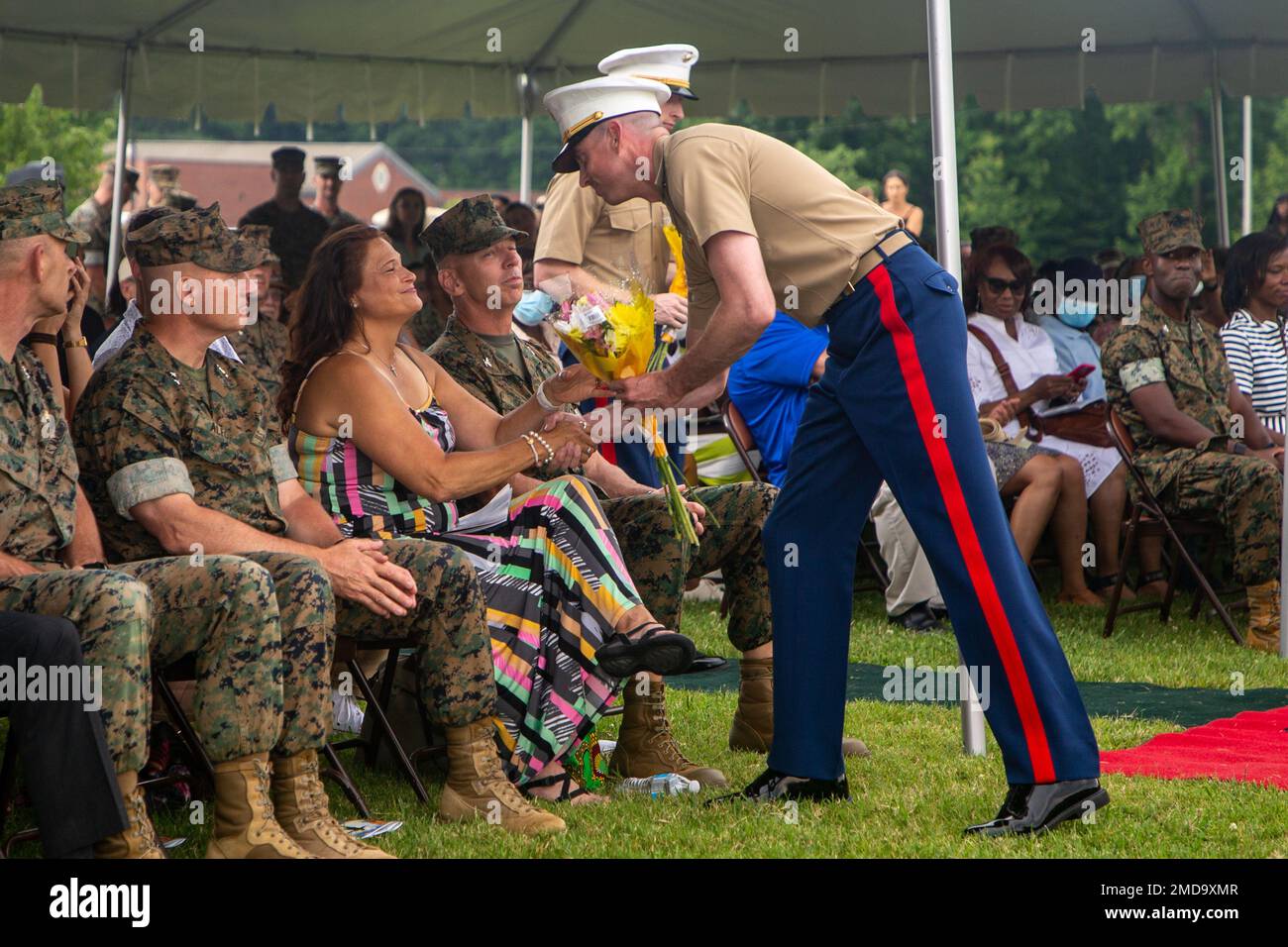 Lisa Schmidt, the wife of Col. Joel F. Schmidt, receives flowers at The ...