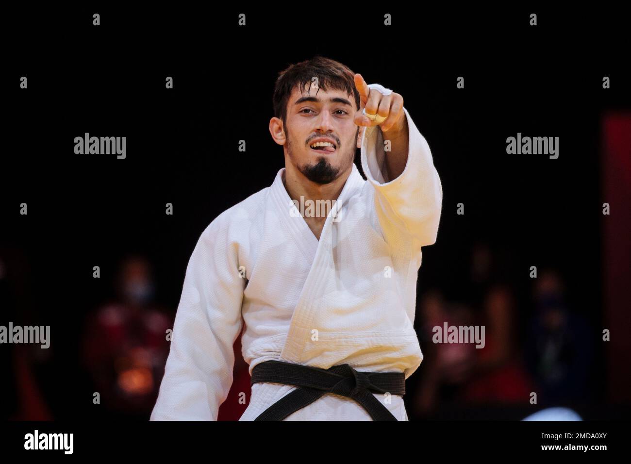 Balabay Aghayev of Azerbaijan celebrates after defeating Ramazan 