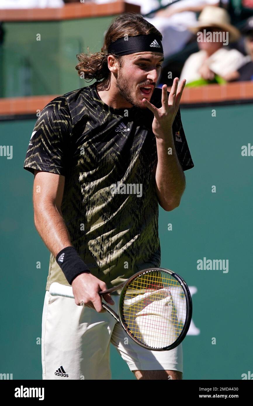 Stefanos Tsitsipas, of Greece, reacts during his match against Nikoloz Basilashvili, of Georgia, at the BNP Paribas Open tennis tournament Friday, Oct. 15, 2021, in Indian Wells, Calif