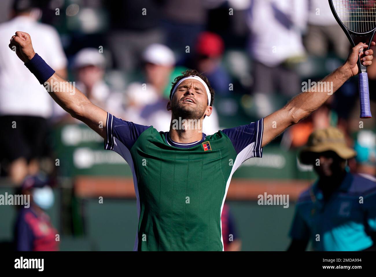Grigor Dimitrov, of Bulgaria, reacts after beating Hubert Hurkacz, of Poland, at the BNP Paribas Open tennis tournament Thursday, Oct. 14, 2021, in Indian Wells, Calif