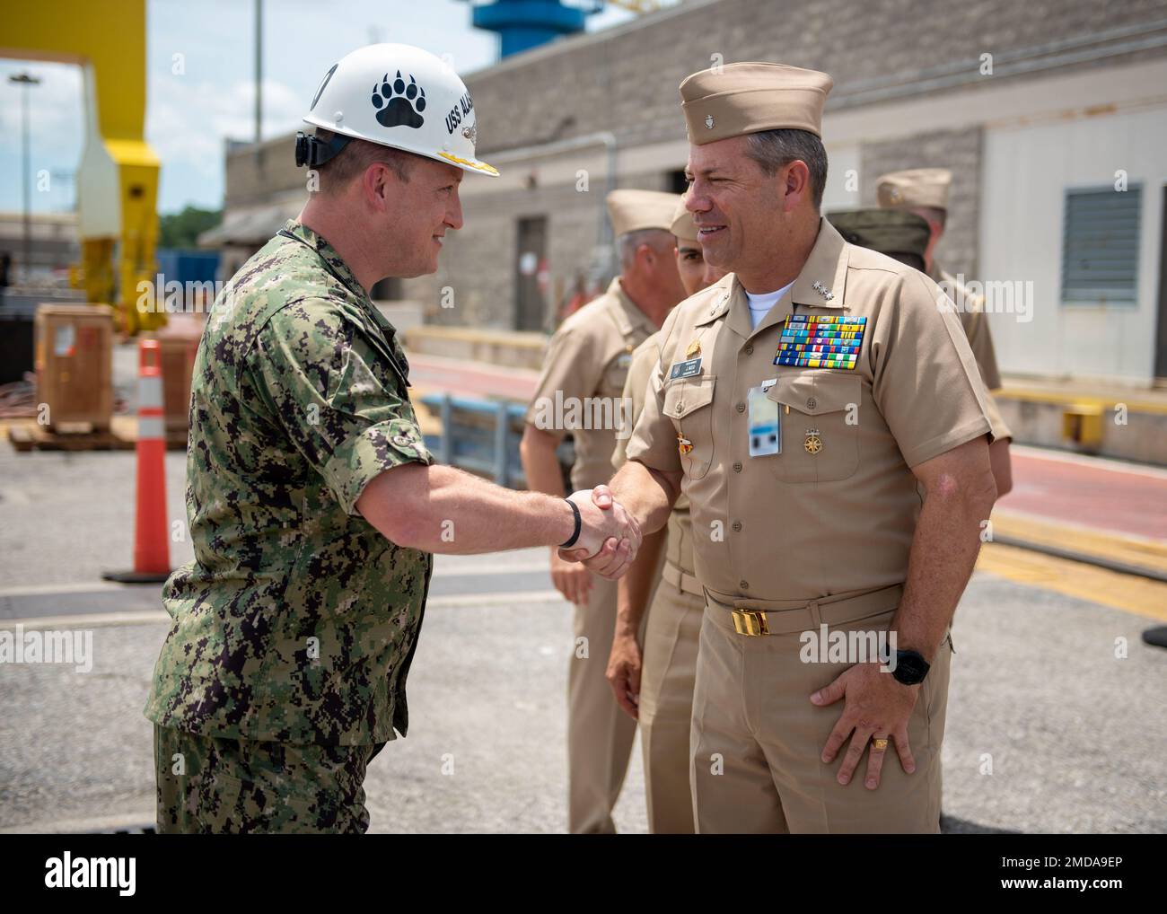 KINGS BAY, Ga. (July 14, 2022) Cmdr. John Smith, commanding officer of the Ohio-class ballistic-missile submarine USS Alaska (SSBN 732) Blue Crew greets Vice Adm. Juan Ricardo Rozo, Commander, Caribbean Naval Force, before a tour aboard the ship. The visit is part of the Diesel Electric Submarine Initiative (DESI) between the United States and partner nations. DESI is a program designed to train crews and test capabilities in Anti-Submarine Warfare between nuclear-powered and diesel-electric submarines. Stock Photo