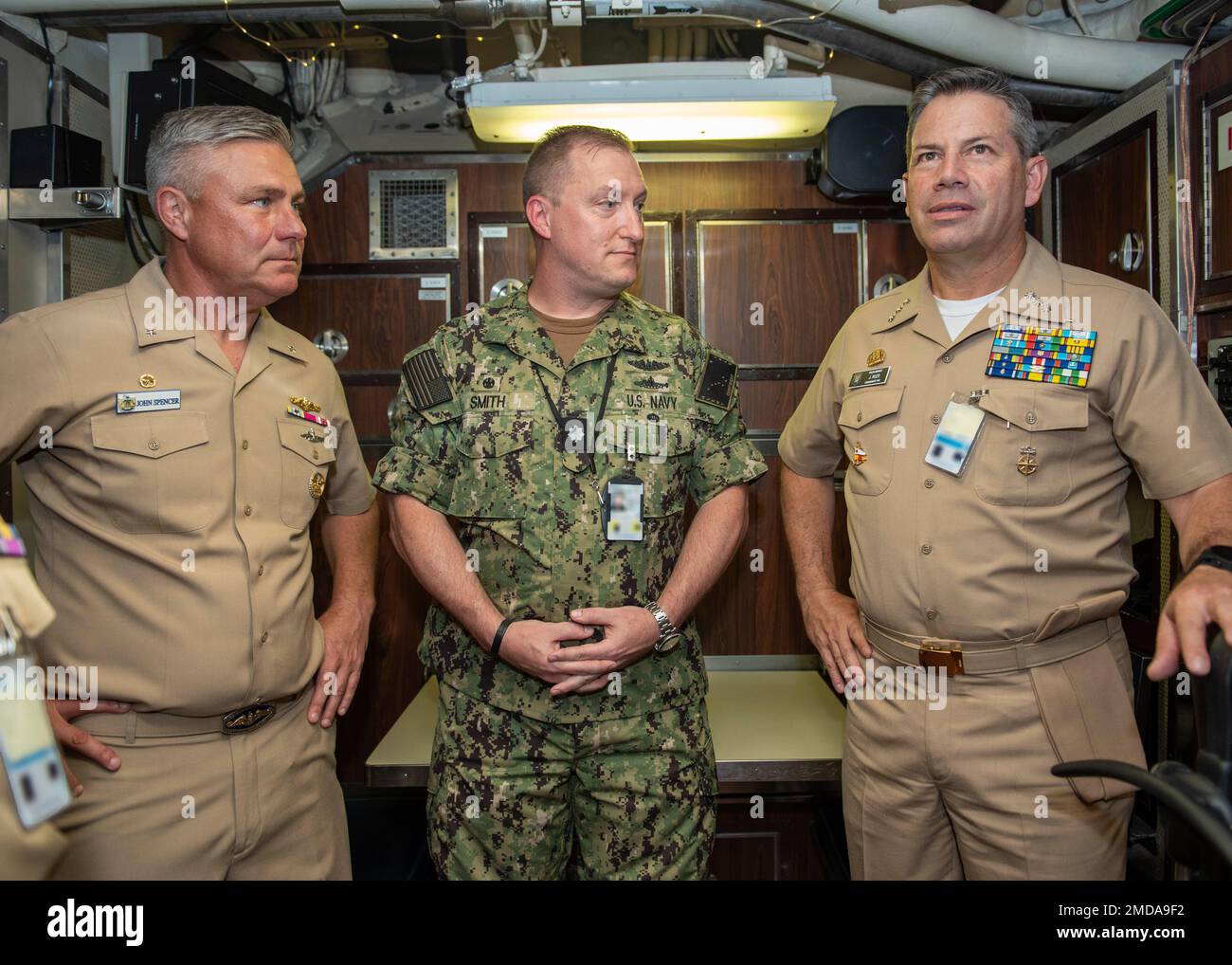 KINGS BAY, Ga. (July. 14, 2022) Rear Adm. John Spencer, Commander, Submarine Group Ten (left) and Cmdr. John Smith, commanding officer of USS Alaska (SSBN 732) Blue Crew (center), brief Vice Adm. Juan Ricardo Rozo, Commander, Caribbean Naval Force, on the capabilities of Ohio-class ballistic-missile submarines. The visit is part of the Diesel Electric Submarine Initiative (DESI) between the United States and partner nations. DESI is a program designed to train crews and test capabilities in Anti-Submarine Warfare between nuclear-powered and diesel-electric submarines. Stock Photo