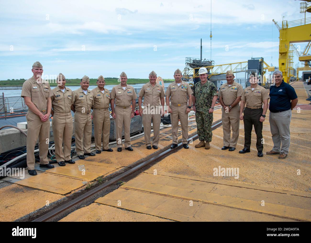 KINGS BAY, Ga. (July 14, 2022) U.S. Navy and partner countries’ Navy submariners pose for a photo in front of the Ohio-class ballistic-missile submarine USS Alaska (SSBN 732) homeported at Naval Submarine Base Kings Bay, Georgia. The visit is part of the Diesel Electric Submarine Initiative (DESI) between the United States and partner nations. DESI is a program designed to train crews and test capabilities in Anti-Submarine Warfare between nuclear-powered and diesel-electric submarines. Stock Photo
