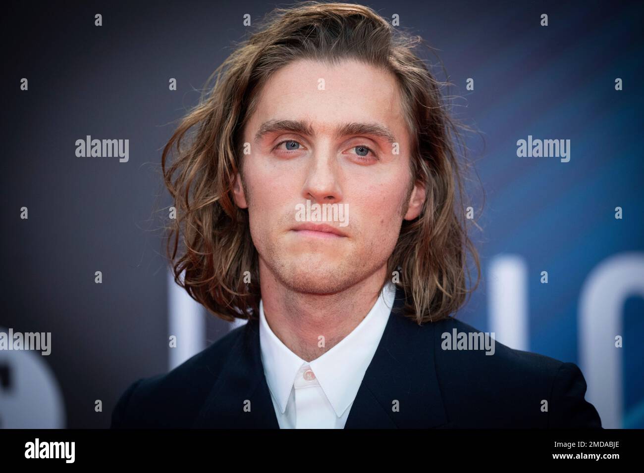 Jack Farthing poses for photographers upon arrival at the premiere of