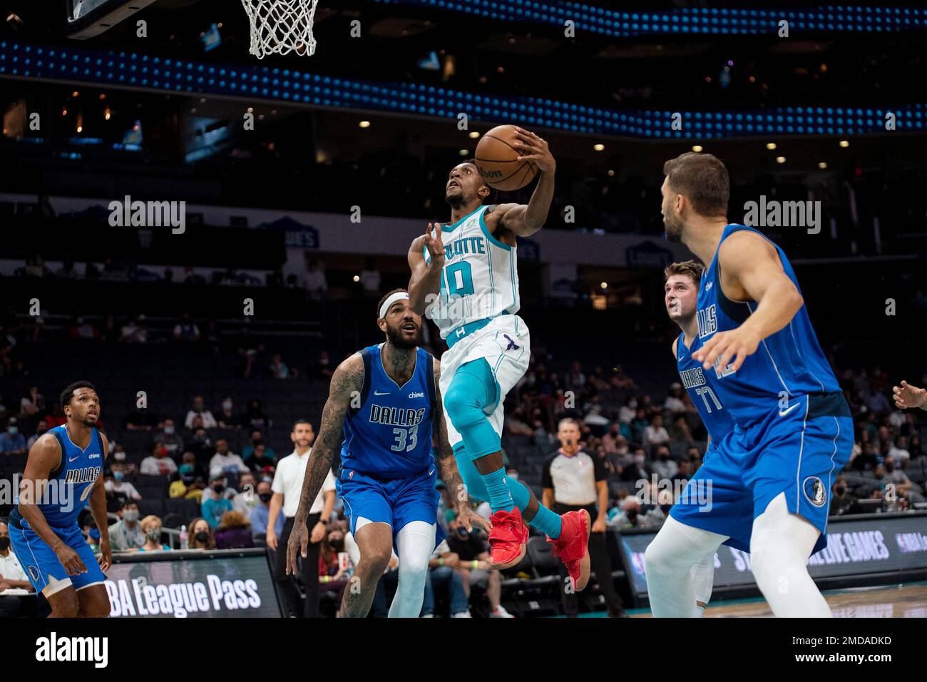 Charlotte Hornets guard Ish Smith (10) goes to the basket during the first half of the teams NBA preseason basketball game against the Dallas Mavericks, Wednesday, Oct