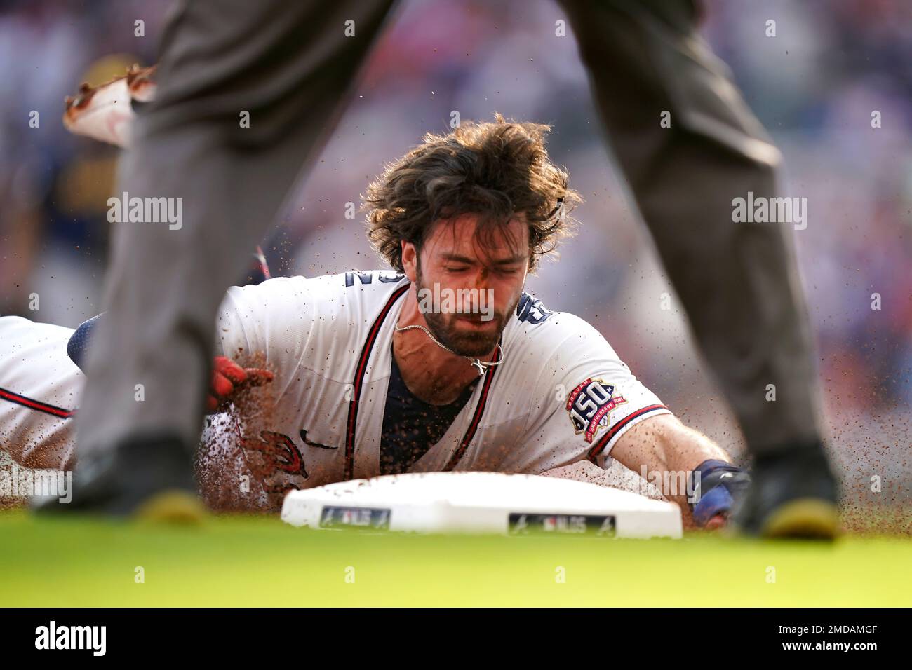 Dansby Swanson of the Atlanta Braves after sliding into third