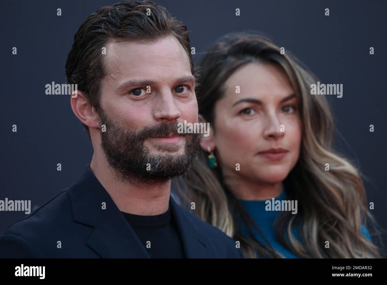 Jamie Dornan, left, and Amelia Warner pose for photographers upon arrival at  the premiere of the film 'Belfast' during the 2021 BFI London Film Festival  in London, Tuesday, Oct. 12, 2021. (Photo