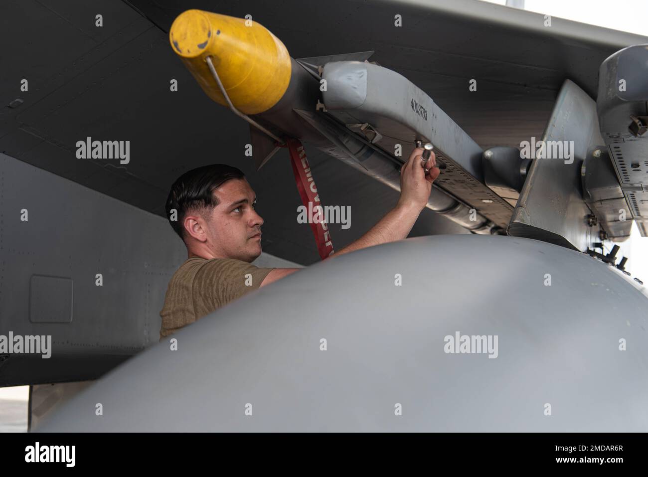 Staff Sgt. Gabriel Gomez, 44th Aircraft Maintenance Unit weapons load crew team chief, secures an AIM-9 Sidewinder missile as part of the F-15 Load Crew of the Quarter Competition at Kadena Air Base, Japan, July 15, 2022. The competition tests load crews’ abilities to load munitions in a safe, reliable, and timely manner. Stock Photo