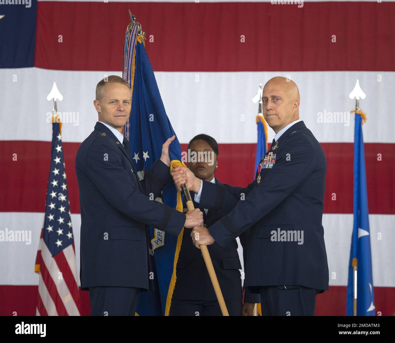 U.S. Air Force Brig. Gen. Josh Olson, outgoing 86th Airlift Wing commander, right, receives a legion of merit award from Maj. Gen. Derek France, Third Air Force commander, during a change of command ceremony at Ramstein Air Base, Germany, July 15, 2022. Olson received the award for meritorious service during his time as the 86 AW commander. Stock Photo