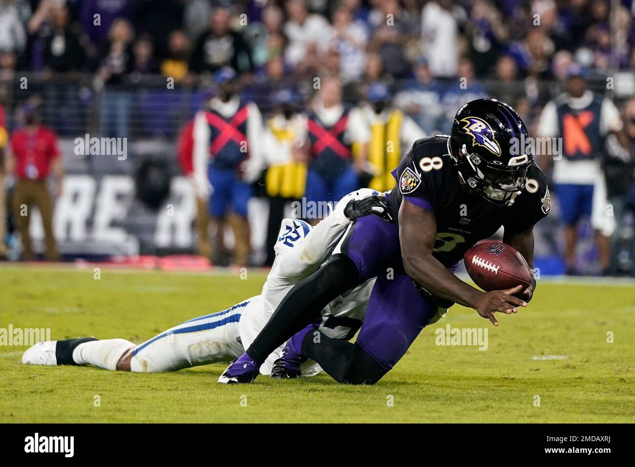 Baltimore Ravens quarterback Lamar Jackson (8) is tackled by Indianapolis  Colts free safety Julian Blackmon (32) causing a fumble during the second  half of an NFL football game Monday, Oct. 11, 2021,