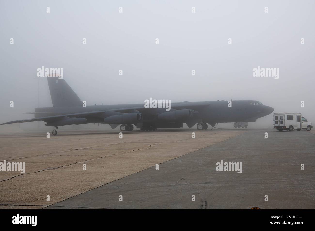 A B52H Stratofortress sits on a flight line preparing for flight at