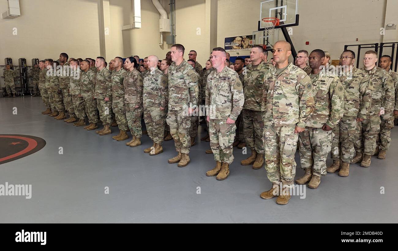 New York Army National Guard Soldiers of the 27th Infantry Brigade Combat Team, who are deploying to Germany as part of the Joint Multinational Training Group-Ukraine, stand at attention during a farewell ceremony at the Thompson Road Armory in Syracuse, New York on July 15, 2022. The New York Soldiers will relieve Florida Army National Guard Soldiers who are currently conducting the training mission. (U.S. Army National Guard photograph by Major Avery Schneider) Stock Photo