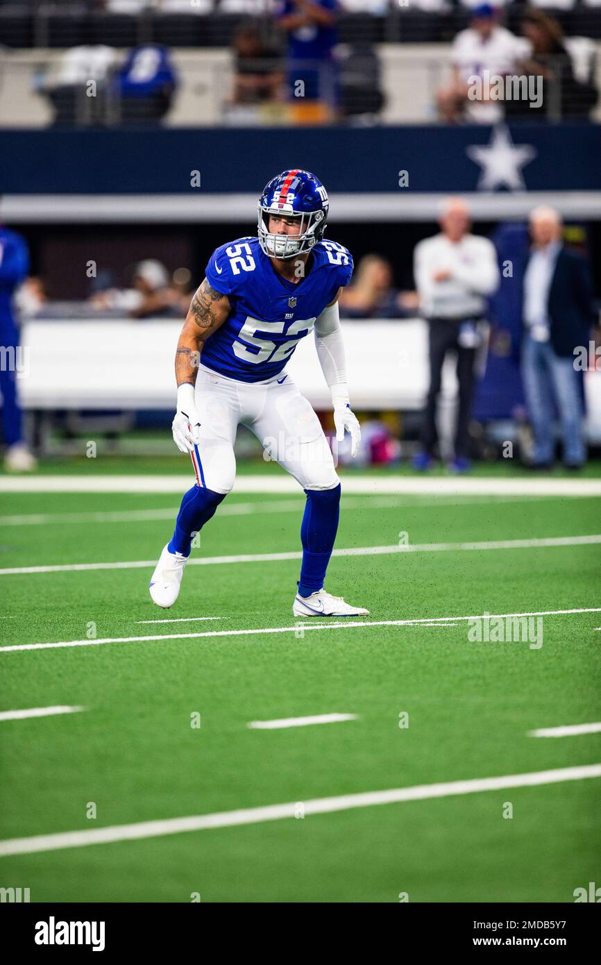 New York Giants linebacker Carter Coughlin (52) walks off the field after  an NFL football game against the Washington Commanders Sunday, Dec. 4,  2022, in East Rutherford, N.J. (AP Photo/Adam Hunger Stock