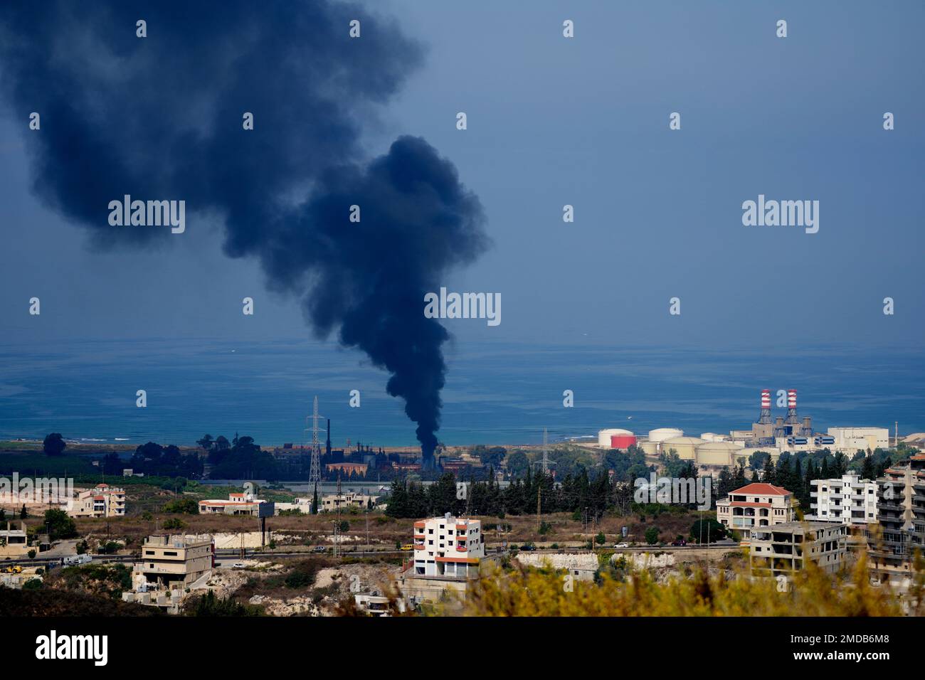 Smoke rises from an oil facility in the southern town of Zahrani, south of  the port city of Sidon, Lebanon, Monday, Oct. 11, 2021. A huge fire broke  out at an oil