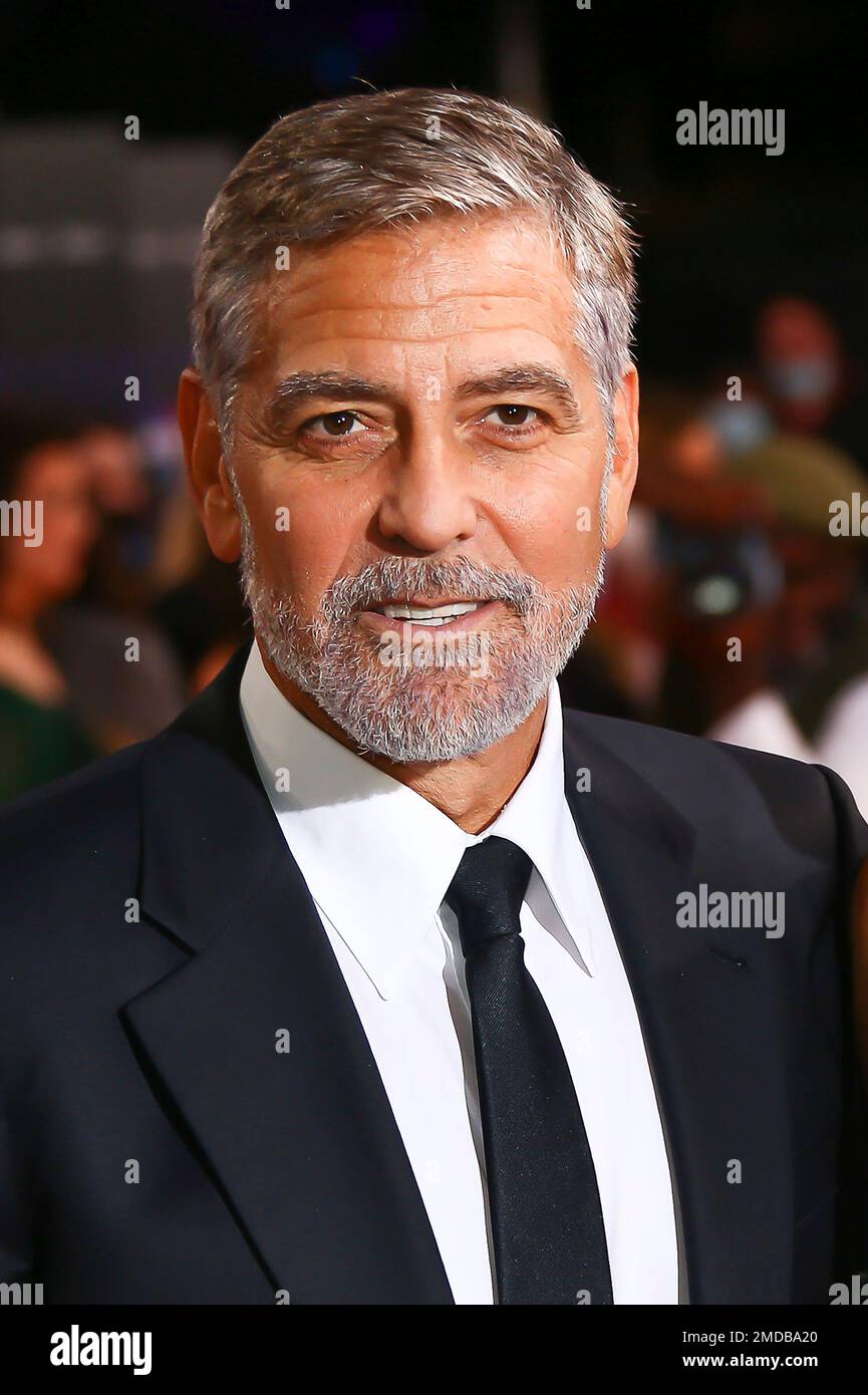 Clooney poses for photographers upon arrival at the premiere of