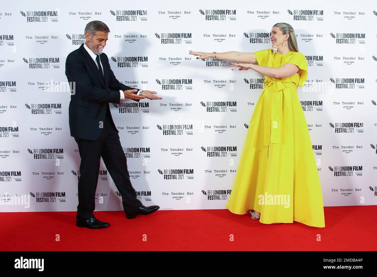 George Clooney and Lily Rabe pose for photographers upon arrival at the ...