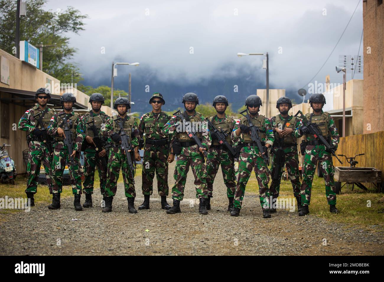 MARINE CORPS TRAINING AREA BELLOWS, Hawaii (July 15, 2022) Indonesia-Korps Marinir Republik Indonesia Marines pose for a group photo while conducting simulated Military Operations in Urban Terrain (MOUT) during Rim of the Pacific (RIMPAC) 2022, July 15. Twenty-six nations, 38 ships, four submarines, more than 170 aircraft and 25,000 personnel are participating in RIMPAC from June 29 to Aug. 4 in and around the Hawaiian Islands and Southern California. The world's largest international maritime exercise, RIMPAC provides a unique training opportunity while fostering and sustaining cooperative re Stock Photo
