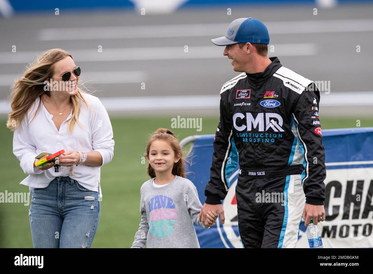 NASCAR Xfinity Series driver Ryan Sieg (39) walks with his family after  driver introductions prior to the NASCAR Xfinity auto racing race at the  Charlotte Motor Speedway Sunday, Oct. 10, 2021, in