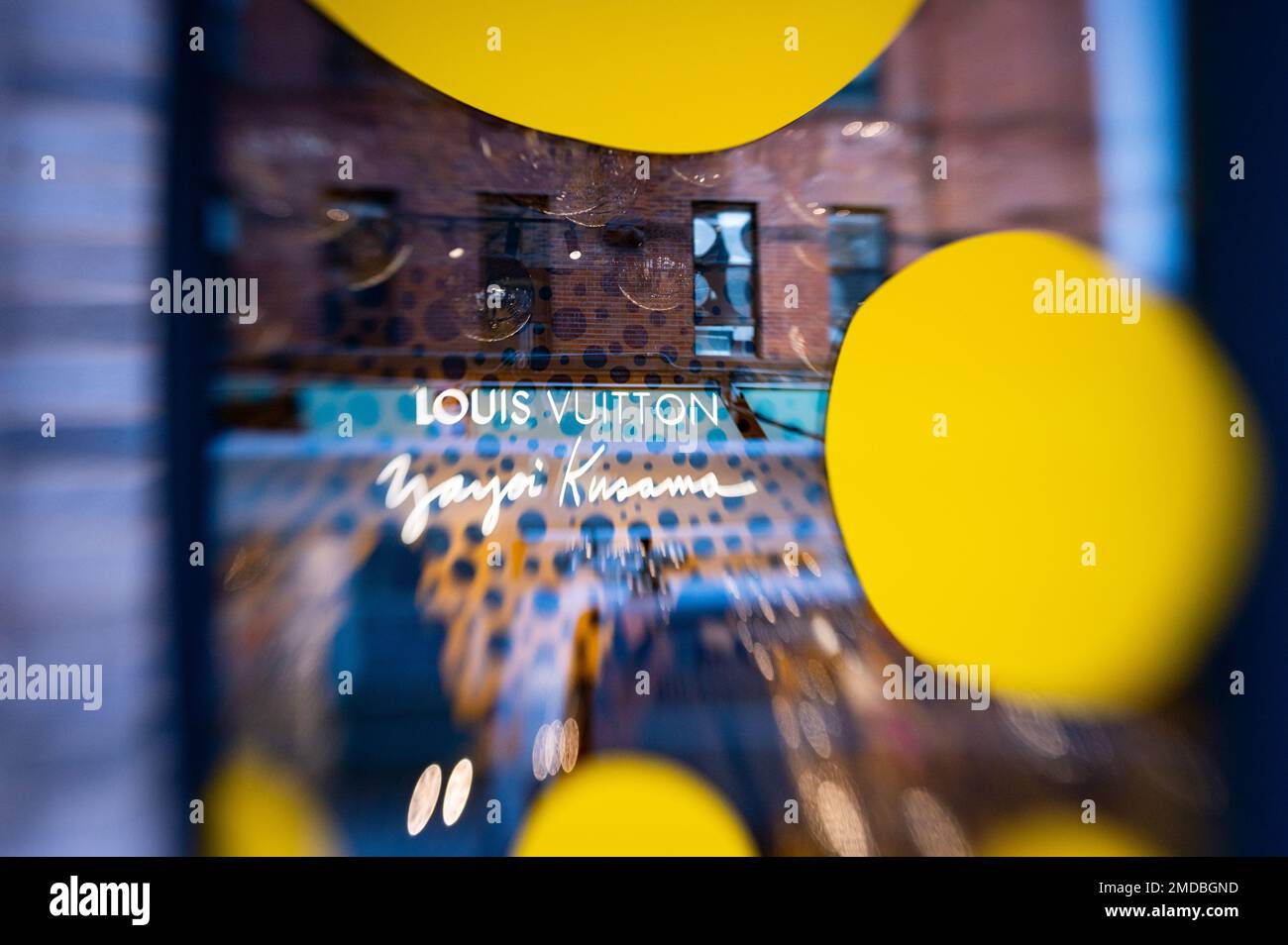 An abstracted, selective focus image of a Louis Vitton pop-up leather goods shop window and building reflections on Gansevoort St in the Meatpacking D Stock Photo