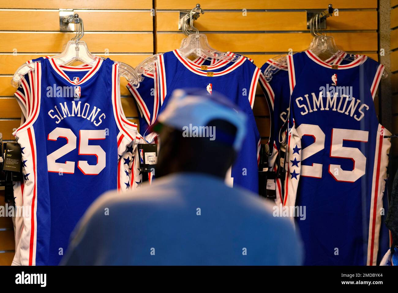 A fan shops for souvenirs before a preseason NBA basketball game between  the Philadelphia 76ers and the Toronto Raptors, Thursday, Oct. 7, 2021, in  Philadelphia. Ben Simmons was out of sight, out