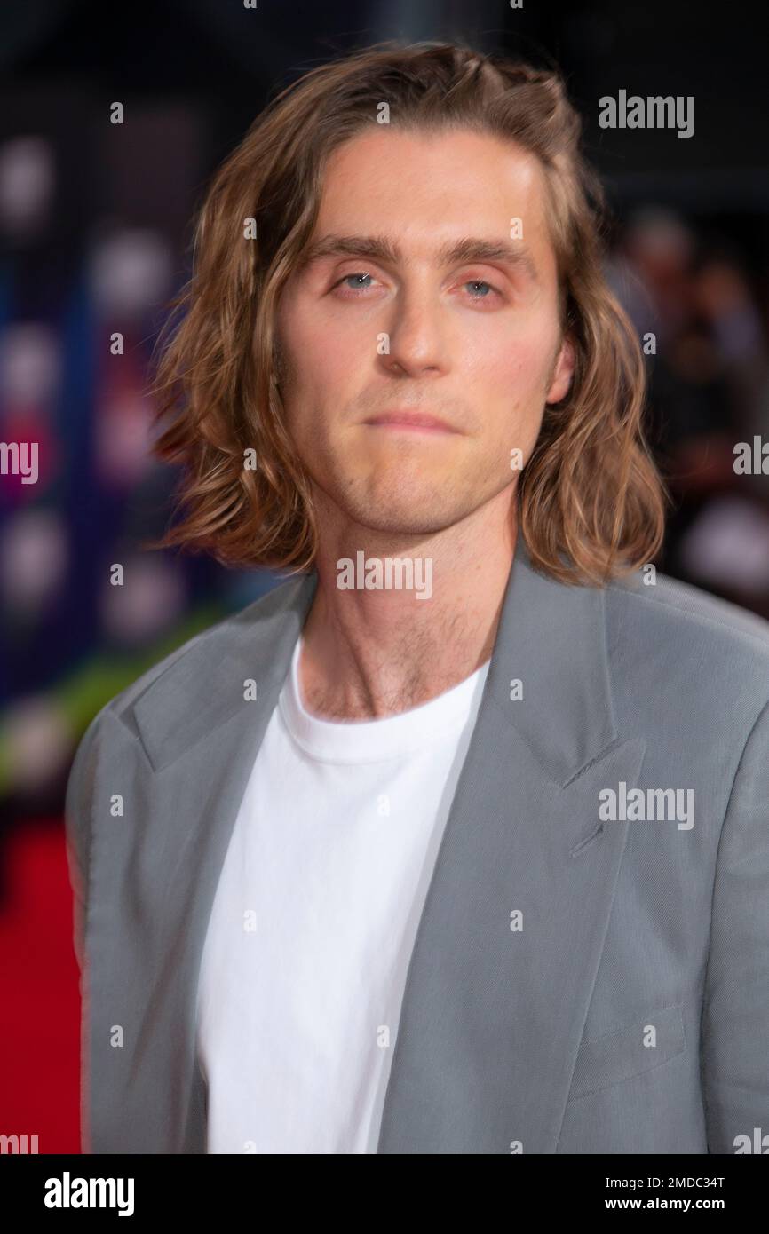 Jack Farthing poses for photographers upon arrival at the premiere of