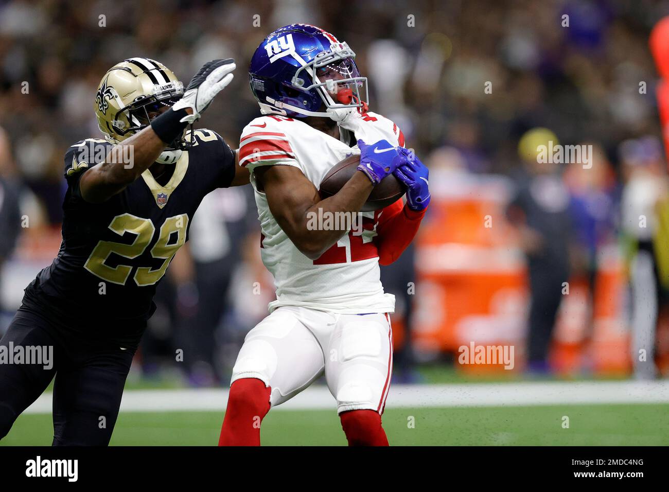 New York Giants wide receiver John Ross (12) catches the ball to score a  touchdown in front of New Orleans Saints cornerback Paulson Adebo (29)  during an NFL football game, Sunday, Oct.