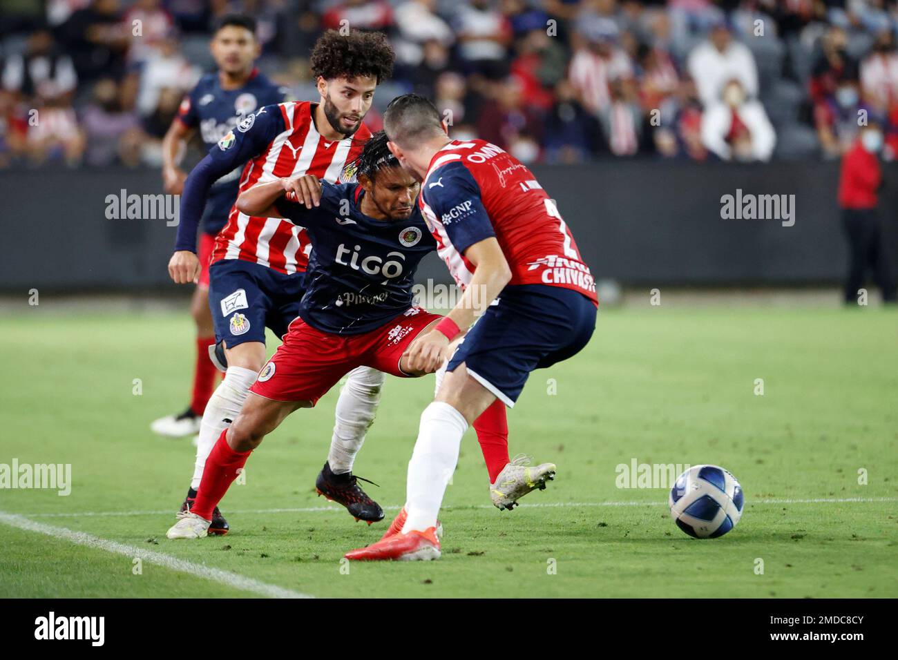 C.D. FAS' Wilma Torres (21) vies the ball against Chivas Guadalajara's  Cesar Huerta (6) and Chivas Guadalajara's Manuel Mayorga (2) during the  second half of a friendly soccer match, Wednesday, Oct. 6,