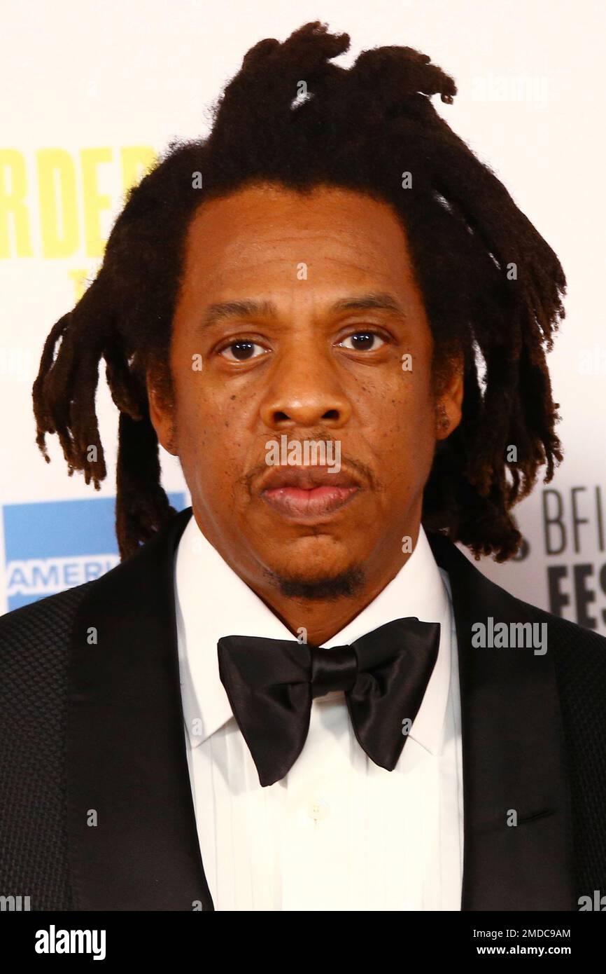 Shawn Carter, known as Jay Z , poses for photographers upon arrival at