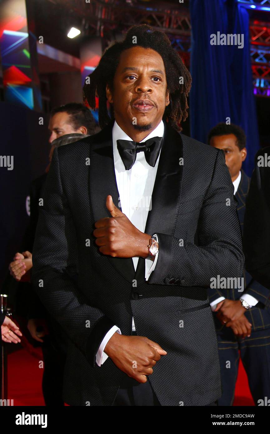 Shawn Carter, known as Jay Z , poses for photographers upon arrival at