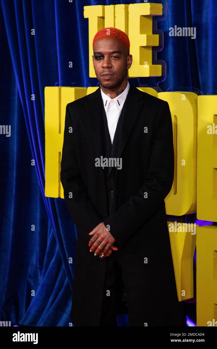Kid Cudi poses for photographers upon arrival at the opening of the