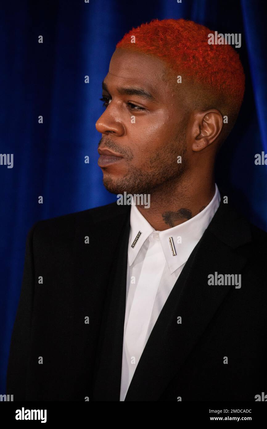 Kid Cudi poses for photographers upon arrival at the opening of the
