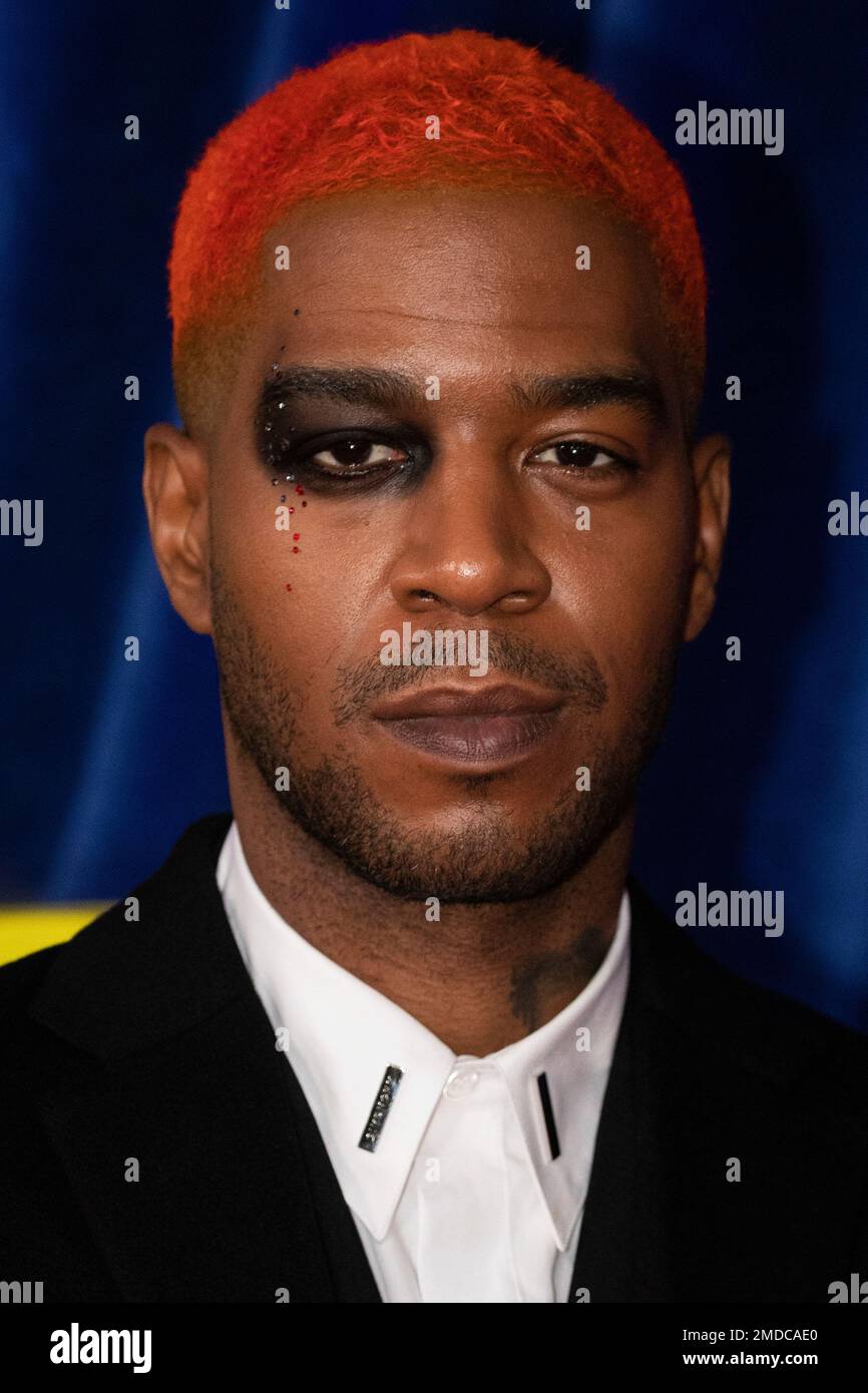 Kid Cudi poses for photographers upon arrival at the opening of the