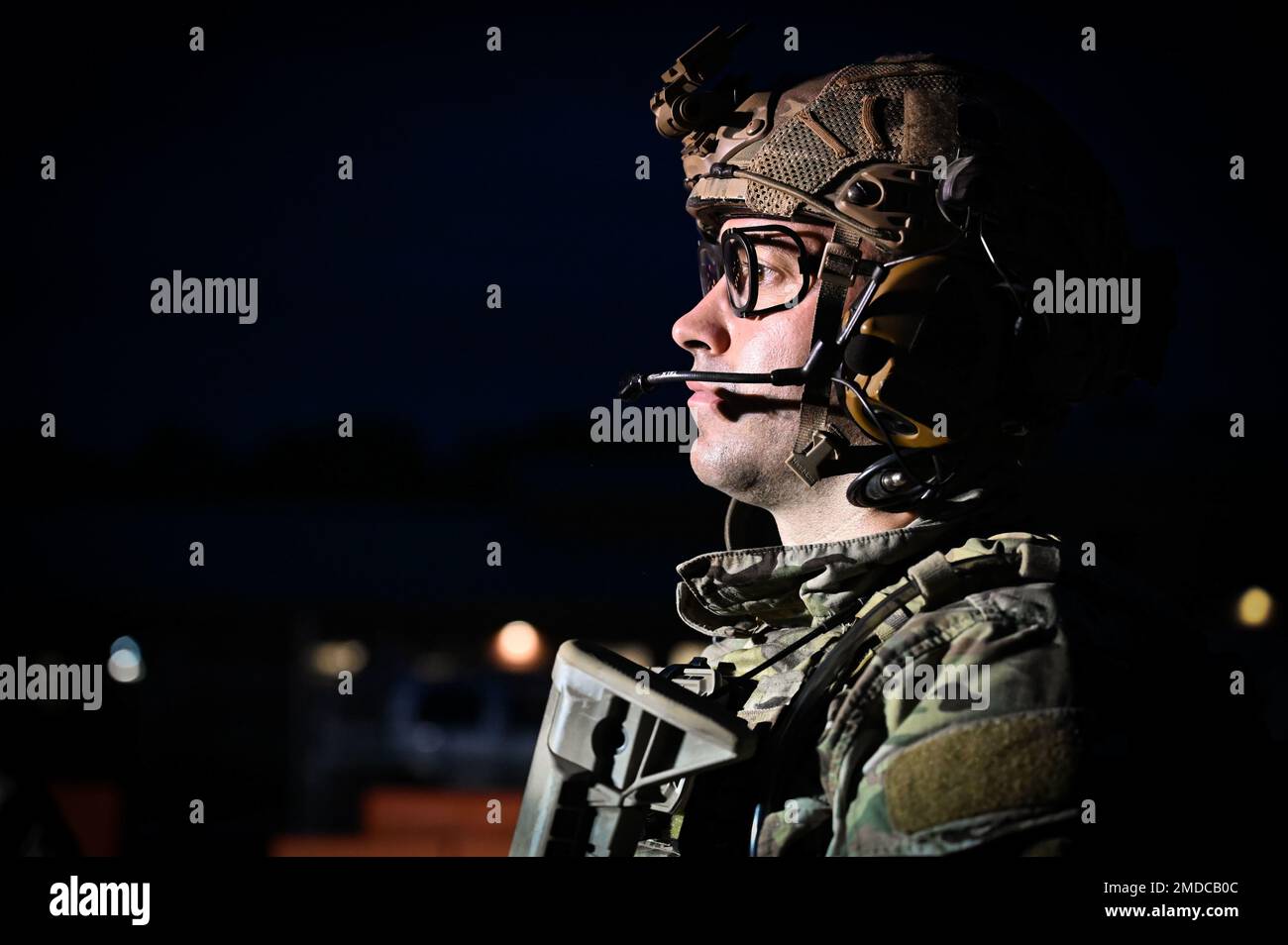 U.S. Air Force Lt. Col. Mike Perry, 165th Air Support Operations Squadron, Georgia Air National Guard, gives a debriefing after participating in an air base ground defense field training exercise as the opposing forces team on July 15, 2022 at the 165th Airlift Wing in Savannah, Georgia. Perry gave feedback to the defenders of the 165th SFS from the opponent's perspective and highlighted some of their strengths in defending their designated air base. Stock Photo