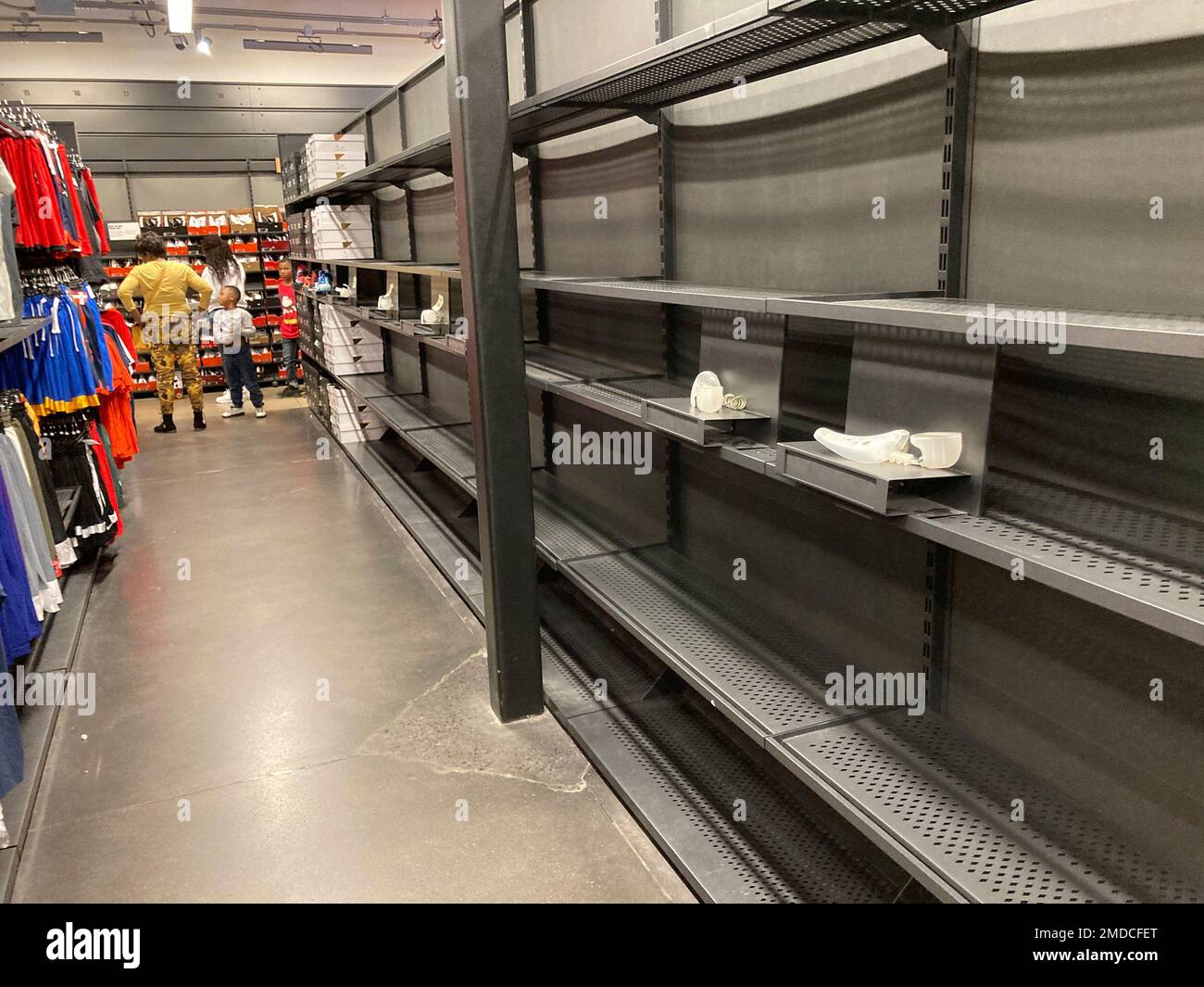Hold For Biz—Shelves usually stocked with boxes of shoes sit empty because  of supply chain shortages in a Nike outlet store in a mall Tuesday, Oct. 5,  2021, in Castle Rock, Colo. (