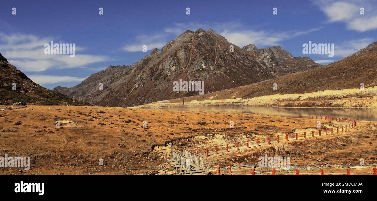 alpine tundra valley, hiking trail and beautiful sela lake, the high himalayan valley is located near sela pass in tawang, arunachal pradesh, north ea Stock Photo